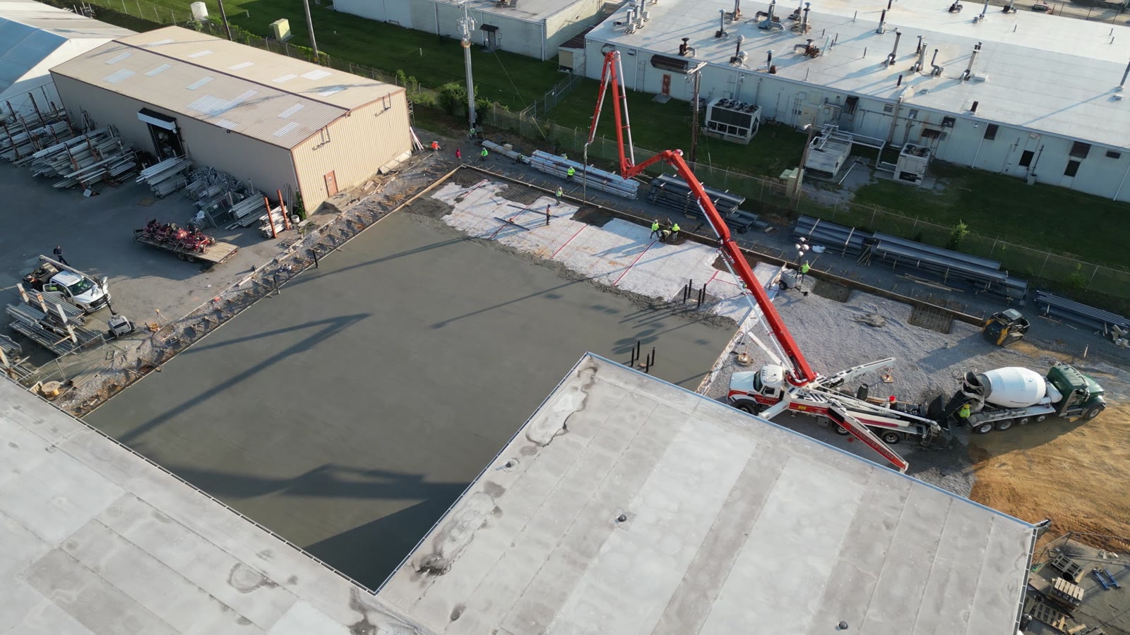 Aerial view of an Esperanza Concrete Design commercial slab pour with a concrete pump boom