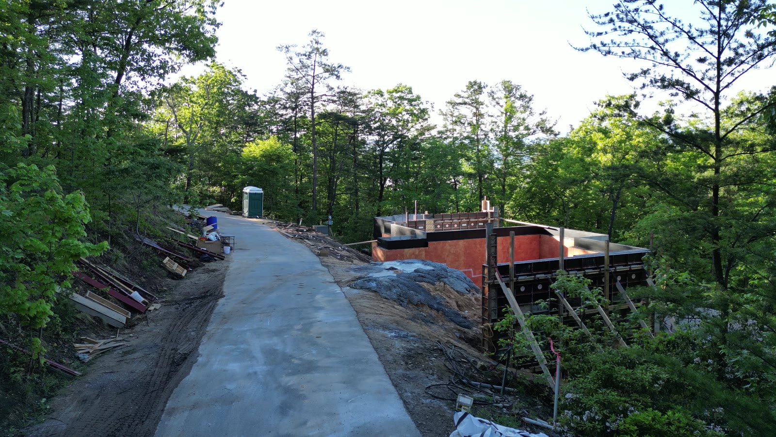 Poured concrete foundation walls with waterproofing on an East Tennessee hillside project