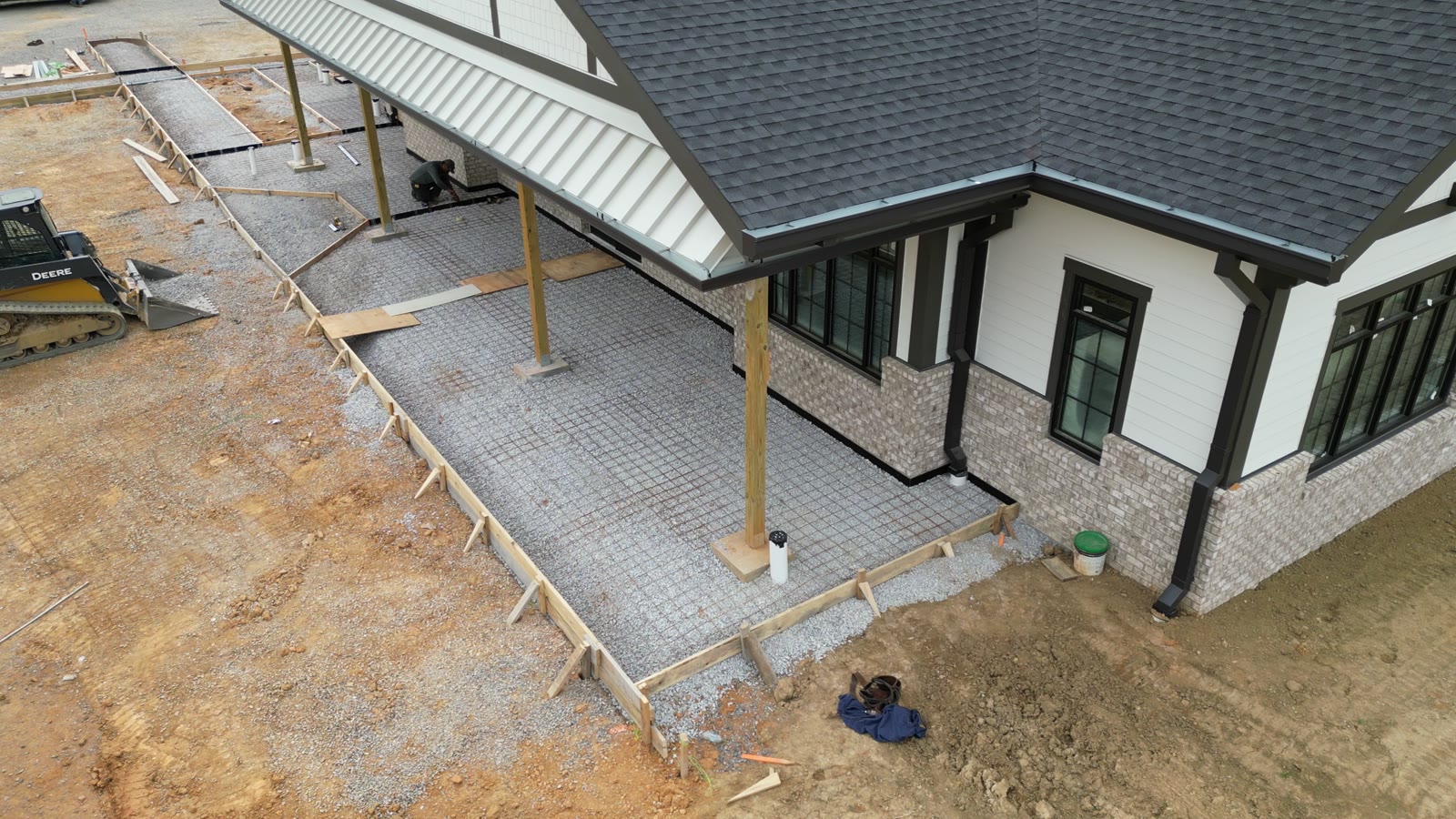 Residential concrete flatwork and sidewalk forming around a custom home